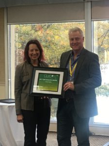 Lisa Presents Chip Coyle with a Beacon Award